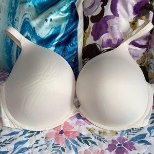Lane Bryant Smooth Boost Plunge bra cream colored.